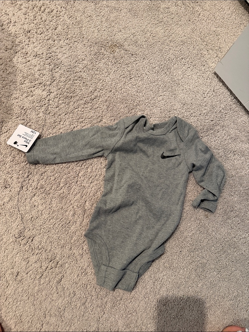 Nike Baby Long Sleeve Bodysuit in Heather Gray with Black Swoosh